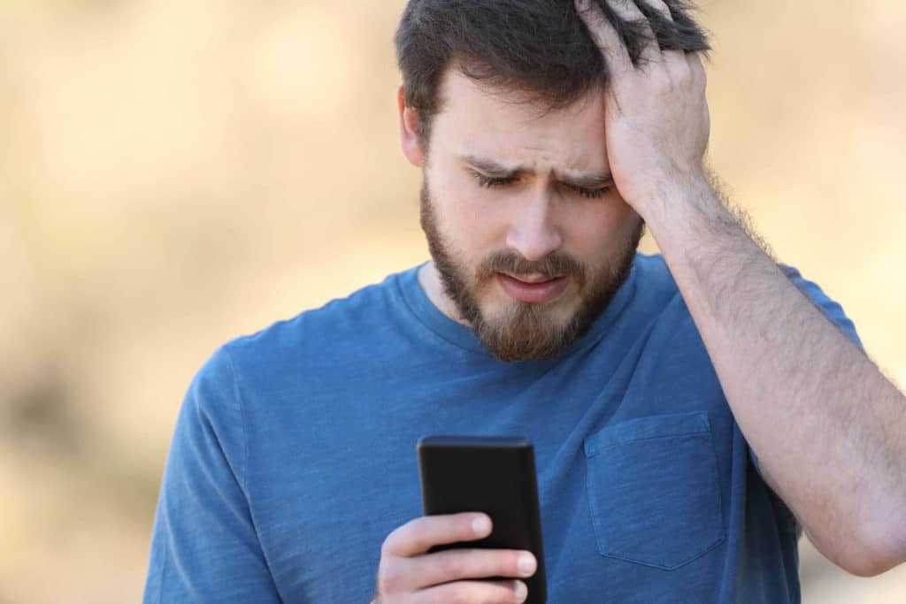 Man looking at text messages