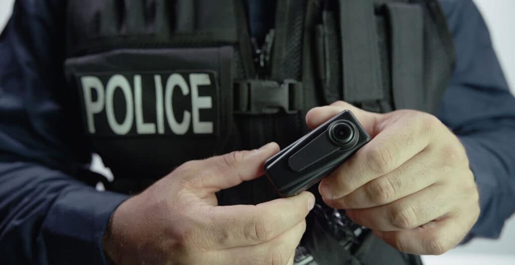 Police officer holding a body camera