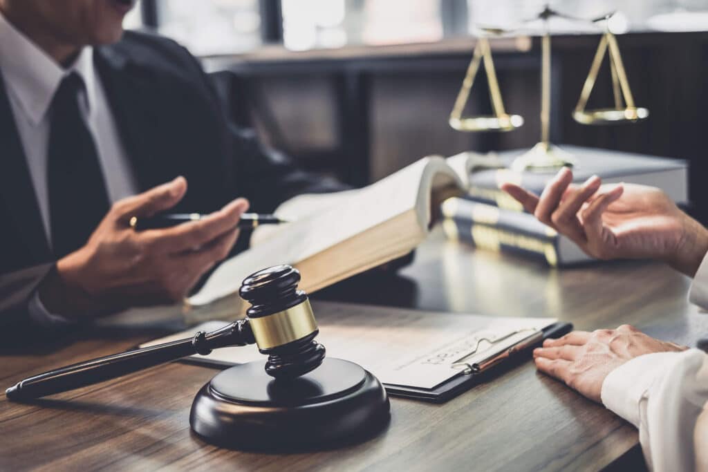 lawyer and judge discussing criminal case at a pre-trial conference