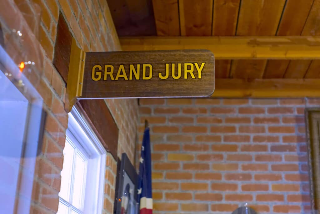Sign above grand jury room in a courthouse