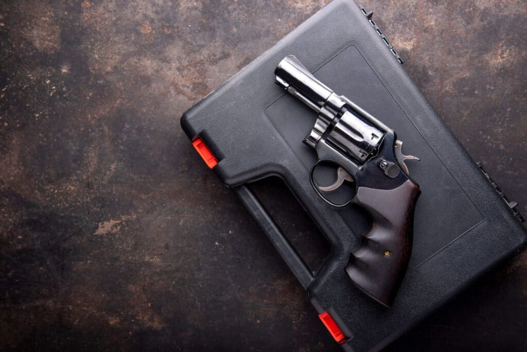 Pistol on top of a gun case