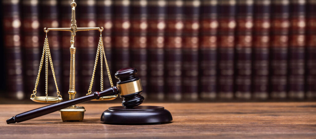 Court gavel and law books in courtroom