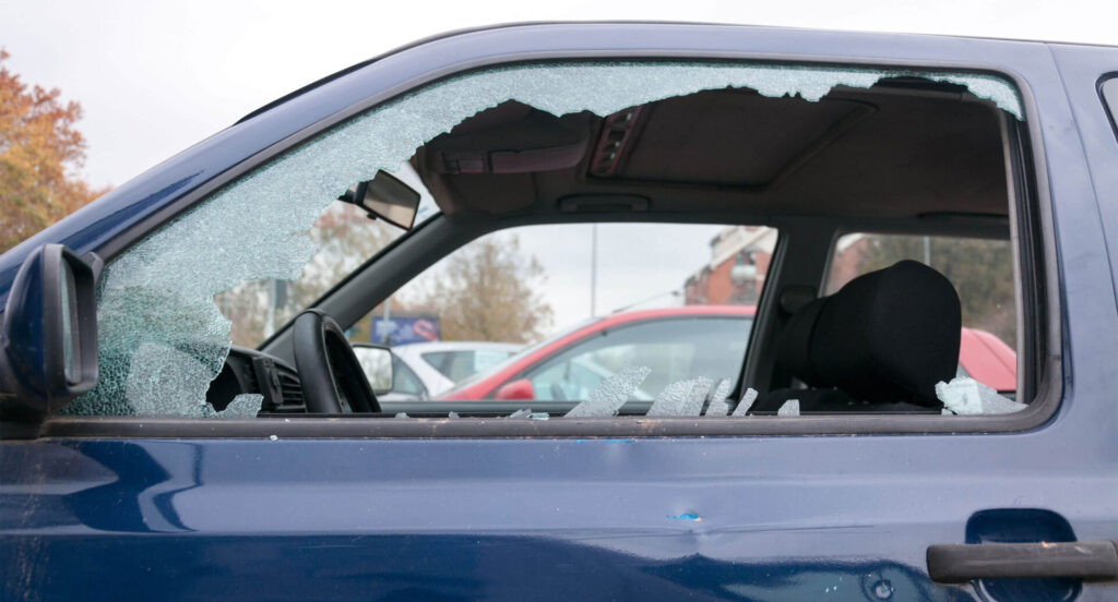 Broken driver's side car window after a car theft 