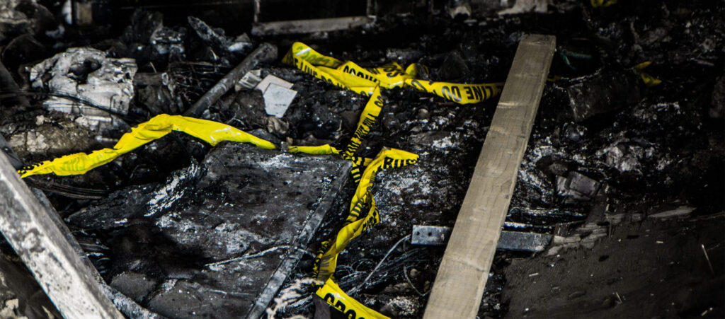 Fire debris at the scene of an arson investigation by the police
