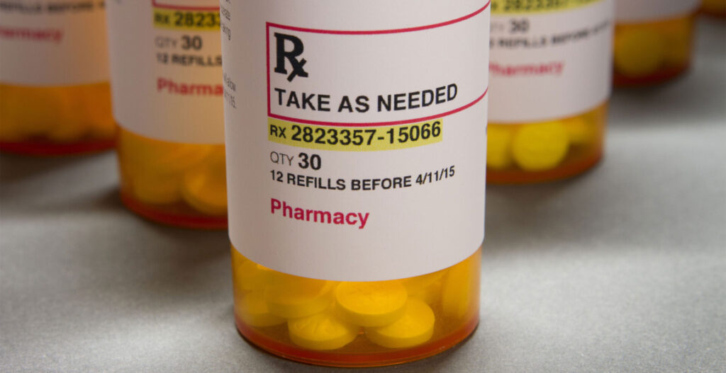 Prescription bottle filled with pain medication