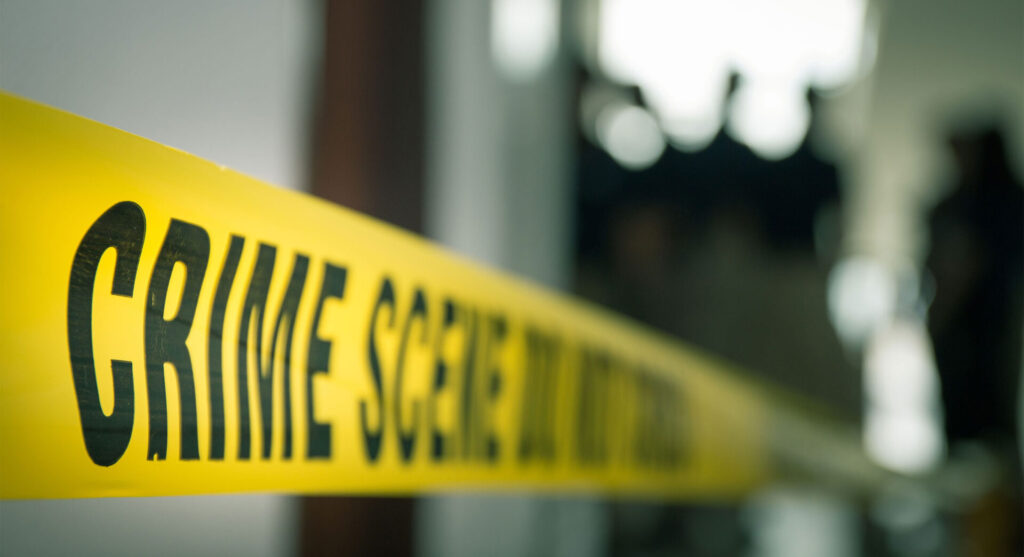 Police crime scene tape at a domestic violence criminal investigation