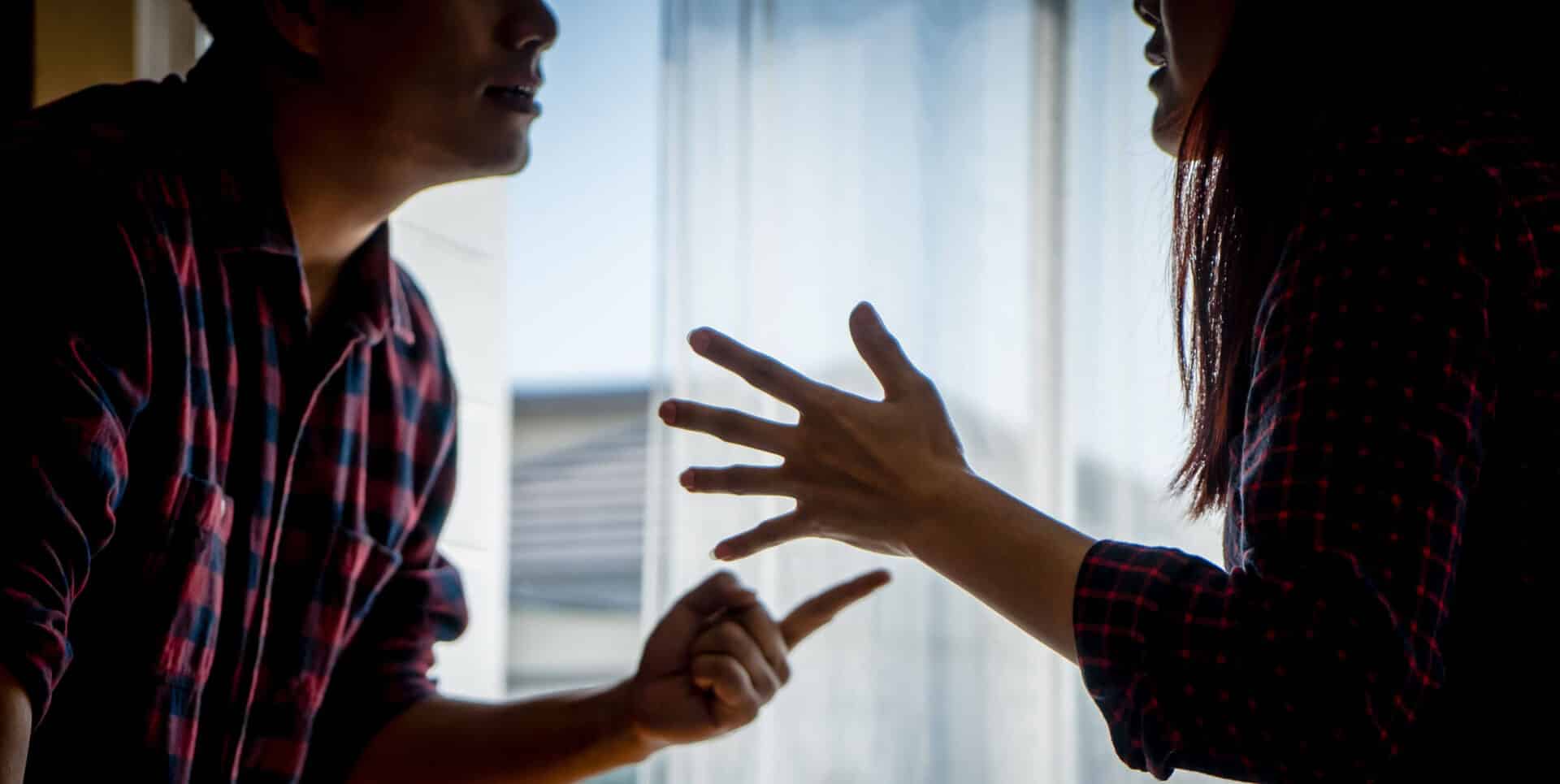 A boyfriend threatening his girlfriend during an argument.