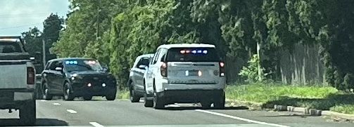 Two police vehicles stop the car of a driver suspected of driving under the influence of marijuana in Bucks County, Pennsylvania.